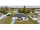 Attractive single-story home with a well-manicured lawn and scenic waterfront view at 83 Alameda Dr, Kissimmee, FL 34743