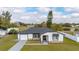 Charming single-story home featuring a well-maintained lawn and neutral color scheme at 83 Alameda Dr, Kissimmee, FL 34743