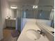 Bathroom with a large vanity and walk-in shower at 835 Griffon Ave, Lake Alfred, FL 33850