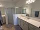 Elegant bathroom with double vanity and large shower at 835 Griffon Ave, Lake Alfred, FL 33850