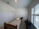 Cozy bedroom featuring a twin-size bed and window at 835 Griffon Ave, Lake Alfred, FL 33850