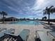 Resort-style pool with lounge chairs and a cabana at 835 Griffon Ave, Lake Alfred, FL 33850
