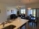 Bright dining room with sliding door access to patio at 835 Griffon Ave, Lake Alfred, FL 33850