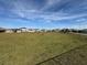 Community dog park with fenced area, benches, and homes in the background at 835 Griffon Ave, Lake Alfred, FL 33850