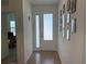 Bright entryway with tile flooring and a gallery wall at 835 Griffon Ave, Lake Alfred, FL 33850