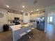 Spacious kitchen featuring an island and stainless steel appliances at 835 Griffon Ave, Lake Alfred, FL 33850