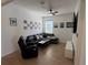 Living room with sectional sofa and large TV at 835 Griffon Ave, Lake Alfred, FL 33850
