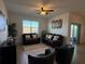 Comfortable living room with brown leather couches at 835 Griffon Ave, Lake Alfred, FL 33850