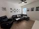 Living room with sectional sofa and wall art at 835 Griffon Ave, Lake Alfred, FL 33850