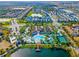 Aerial view of community amenities including pool and surrounding homes at 8886 Geneve Ct, Kissimmee, FL 34747