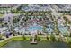 Community pool, tennis court, and lake from above at 8886 Geneve Ct, Kissimmee, FL 34747