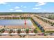 Aerial view of townhouses with lake access at 8886 Geneve Ct, Kissimmee, FL 34747