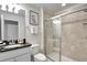 Bathroom with a walk in shower, toilet and granite countertop at 8886 Geneve Ct, Kissimmee, FL 34747