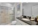 Bathroom with a shower, toilet and granite countertop at 8886 Geneve Ct, Kissimmee, FL 34747