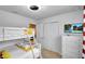 Bedroom with bunk beds, a TV, and yellow bedding at 8886 Geneve Ct, Kissimmee, FL 34747