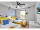 ' bedroom with twin beds, Minions wall decor, and a TV at 8886 Geneve Ct, Kissimmee, FL 34747