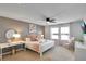 Main bedroom with king bed and en-suite bathroom at 8886 Geneve Ct, Kissimmee, FL 34747