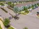 Gated community entrance with landscaping and palm trees at 8886 Geneve Ct, Kissimmee, FL 34747