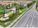 Community entrance sign and landscaping at 8886 Geneve Ct, Kissimmee, FL 34747