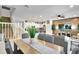 Dining area with wood table and access to kitchen at 8886 Geneve Ct, Kissimmee, FL 34747
