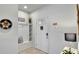 Inviting entryway with built-in bench seating and shelving at 8886 Geneve Ct, Kissimmee, FL 34747