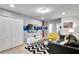 Spacious game room with TV, comfortable seating, and large closet at 8886 Geneve Ct, Kissimmee, FL 34747