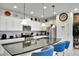 Modern kitchen with stainless steel appliances and a large island at 8886 Geneve Ct, Kissimmee, FL 34747