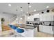 Modern kitchen with white cabinets and granite countertops at 8886 Geneve Ct, Kissimmee, FL 34747
