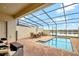 Private screened pool and patio area with seating at 8886 Geneve Ct, Kissimmee, FL 34747