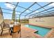 Private screened pool and patio with seating at 8886 Geneve Ct, Kissimmee, FL 34747