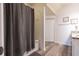 Bathroom featuring a bathtub with shower curtain, a closet, and a vanity at 8919 Shine Dr, Kissimmee, FL 34747