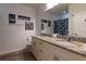 Bathroom featuring a double sink vanity with granite countertops and Star Wars themed decorations at 8919 Shine Dr, Kissimmee, FL 34747