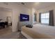 Bedroom with a large screen television and access to dining area at 8919 Shine Dr, Kissimmee, FL 34747