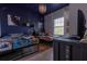 Star Wars themed bedroom featuring two twin beds, decorative lighting, and themed artwork at 8919 Shine Dr, Kissimmee, FL 34747
