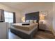 Cozy bedroom with neutral tones, accent pillows and a large bed at 8919 Shine Dr, Kissimmee, FL 34747