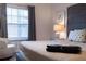 Bedroom with a comfortable bed, soft lighting, and a serene ambiance near the window at 8919 Shine Dr, Kissimmee, FL 34747