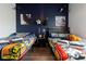Themed bedroom showcasing a Star Wars motif and two beds at 8919 Shine Dr, Kissimmee, FL 34747