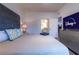 Comfortable bedroom with a plush bed, TV, and an ensuite bathroom for added convenience at 8919 Shine Dr, Kissimmee, FL 34747