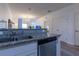 Kitchen area with stainless steel appliances, white cabinets, and granite countertops at 8919 Shine Dr, Kissimmee, FL 34747