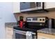 Well-equipped kitchen featuring stainless steel appliances and granite countertops at 8919 Shine Dr, Kissimmee, FL 34747