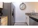 Bright kitchen boasts a large stainless steel refrigerator and granite countertops with ample space at 8919 Shine Dr, Kissimmee, FL 34747