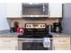 Modern kitchen design featuring stainless steel appliances and a stylish backsplash at 8919 Shine Dr, Kissimmee, FL 34747