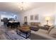Open living space with modern furnishings, contemporary lighting, and seamless flow to dining at 8919 Shine Dr, Kissimmee, FL 34747