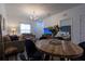 Bright and airy living space with dining area and glimpse of the bedroom, ideal for relaxation at 8919 Shine Dr, Kissimmee, FL 34747