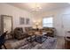 Comfortable living room featuring stylish decor, a modern chandelier, and lots of natural light at 8919 Shine Dr, Kissimmee, FL 34747
