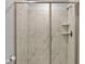 Clean bathroom with a walk-in shower with marble tile at 9234 Sommerset Hills Dr, Davenport, FL 33896