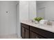 Double vanity bathroom with dark brown cabinets at 9234 Sommerset Hills Dr, Davenport, FL 33896