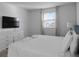 King-size bed, dresser, and large window in this bedroom at 9234 Sommerset Hills Dr, Davenport, FL 33896