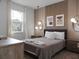 Modern bedroom with stylish decor and large windows at 9234 Sommerset Hills Dr, Davenport, FL 33896