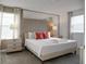 Main bedroom with a king-size bed and stylish decor at 9234 Sommerset Hills Dr, Davenport, FL 33896